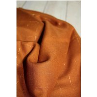 Eglantine and Zoe Lurex Viscose Twill Fabric Caramel & Copper